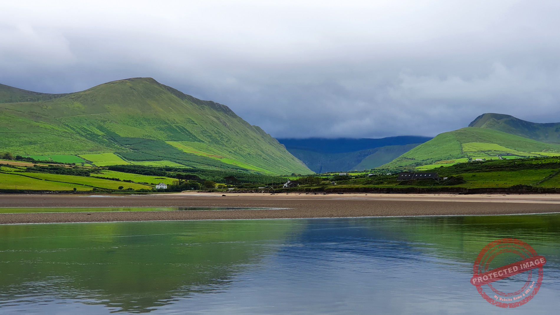 Binn an Tuair and Gob an Iolar reflecting in the tidal waters of An Scóraid.